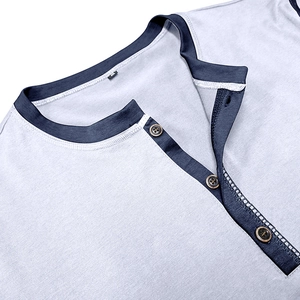 Close-up of three-button Henley collar with navy blue trim and gray textured knit fabric