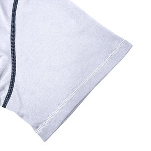 Detail view of light grey Henley T-shirt sleeve with white reinforced stitching and texture