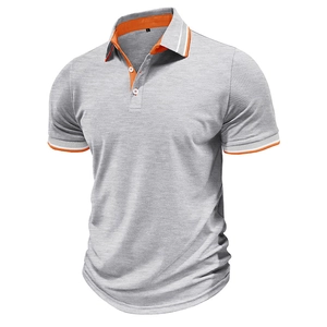 Detail of grey polo shirt featuring orange inner collar and white striped sleeve cuffs