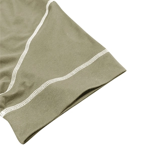 Detail shot of double-needle stitching on olive green muscle shirt cuff and hem