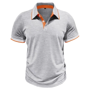 Detail of grey polo shirt featuring orange contrast collar and striped sleeve cuffs