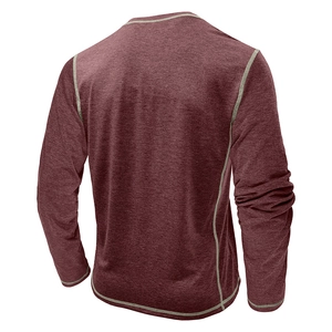 Detail view of burgundy long sleeve Henley shirt with light gray contrast stitching