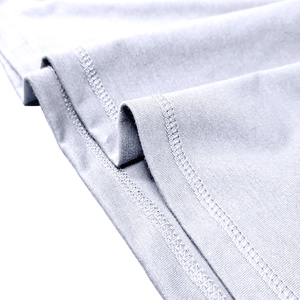 Detail view of high-density knit fabric with reinforced double-needle stitching