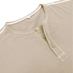Detailed close-up of khaki Henley shirt collar with white stitching and three buttons