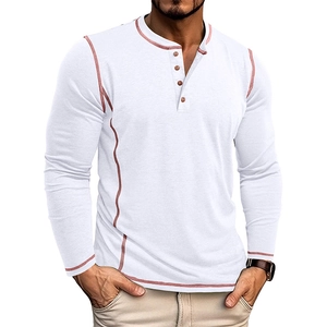 Detail of white Henley shirt featuring contrast stitching and four brown buttons
