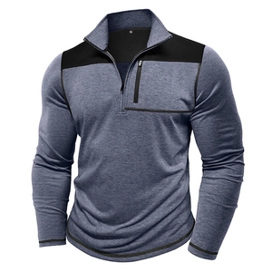 Detail of blue heather quarter-zip pullover with black contrast panels and chest pocket