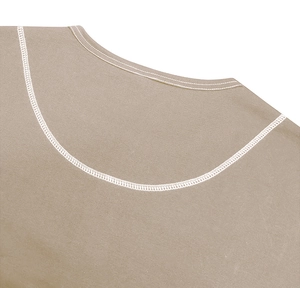 Detail of reinforced double-needle stitching on beige Henley shirt neckline and fabric