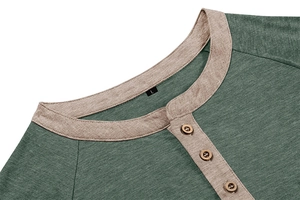 Detail of green knit Henley shirt featuring wood buttons and contrasting beige collar