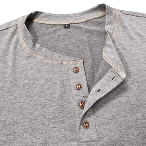 Detail of the Henley neckline with brown buttons on a grey cotton short sleeve T-shirt