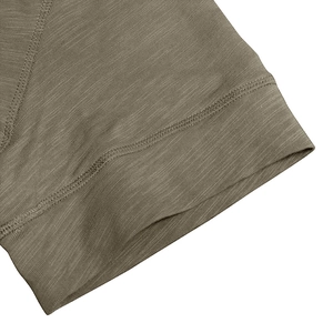 Detailed close-up of slub cotton fabric texture and double-needle stitching on short sleeve