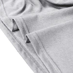 Close-up of light gray piqué knit fabric showing detailed double-needle hem stitching