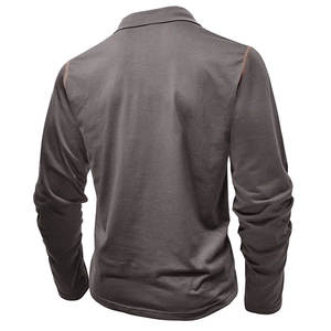Detail view of reinforced shoulder stitching on the back of a dark gray long-sleeve polo shirt