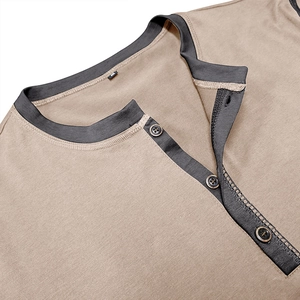 Close-up of khaki Henley shirt collar with grey contrast placket and three metal buttons