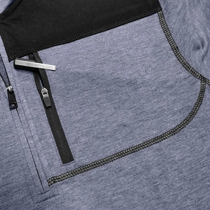 Macro detail of men's tactical sweatshirt showing fabric texture and zip pocket