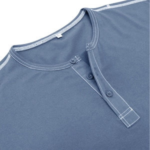 Detailed close-up of Henley neckline with contrast stitching and buttons on blue shirt