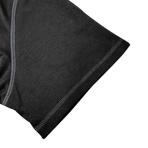 Detail view of professional flatlock stitching and knit texture on black Henley t-shirt sleeve