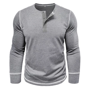 Detail of grey Henley shirt showing buttoned collar and white contrast stitching