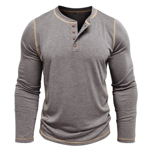 Detailed view of grey Henley shirt with contrast yellow stitching and four-button neckline