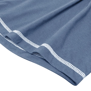 Macro shot of blue cotton muscle shirt featuring precise white double-needle stitching detail