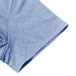Close-up of heather blue polo shirt sleeve featuring reinforced double-needle stitching
