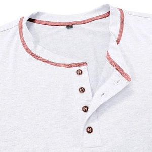 Detail of grey Henley shirt showing pink trimmed collar and four brown wooden buttons