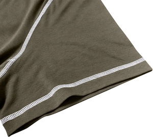 Macro shot of men's knit shorts featuring white flatlock stitching and olive fabric texture