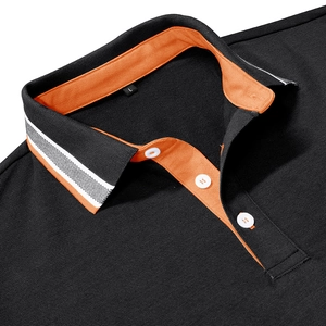 Close-up of black pique Polo collar with contrast orange lining and striped trim detail