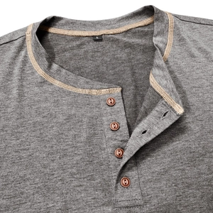 Close-up of gray knit Henley shirt neckline with four brown buttons and khaki stitching