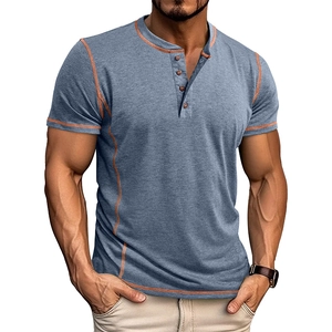 Detail of grey blue Henley shirt with orange contrast stitching and four-button placket