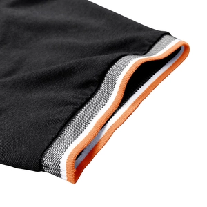 Detail of piqué fabric texture and tri-color ribbed cuffs with orange and white stripes