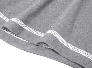 Detail of grey knitted fabric showing professional double-needle stitching and cotton texture