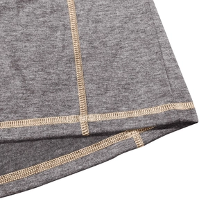 Close-up of grey textured knit fabric showing professional reinforced stitching detail