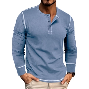 Detail of blue-grey long sleeve Henley shirt featuring contrast stitching and button placket