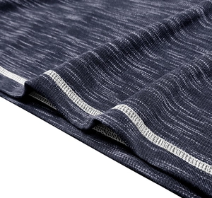 Macro view of dark blue heather fabric texture with white double-needle stitching detail