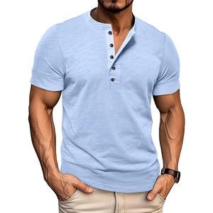 Detail of light blue Henley shirt neckline with textured fabric and dark buttons