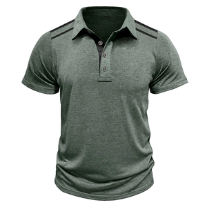 Close-up detail of grey-green polo shirt showing black shoulder stripes and button collar