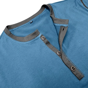 Macro shot of blue Henley shirt collar with grey three-button placket and M size label