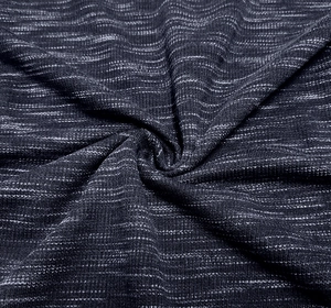 Close-up of grey melange knitted fabric texture with soft drapes and fine weave