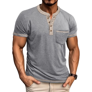 Close-up detail of grey cotton Henley shirt with cream collar trim and three-button placket