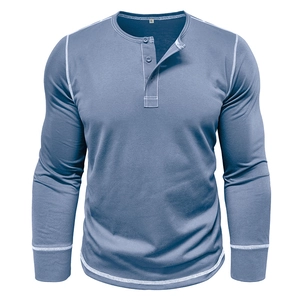 Detail of blue men's Henley shirt featuring a three-button placket and white contrast stitching