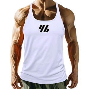 Close-up of white workout tank top showing breathable fabric and black geometric print