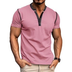 Detail of light pink men's Henley shirt featuring dark grey contrast button placket