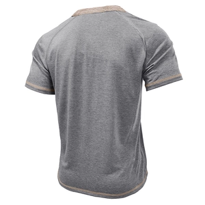 Detail view of khaki contrast stitching on grey Henley shirt raglan sleeve and textured fabric