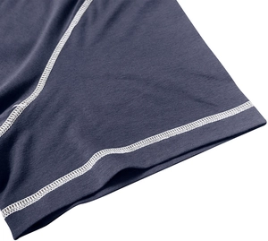 Detailed close-up of navy blue knit fabric with white contrast flatlock stitching