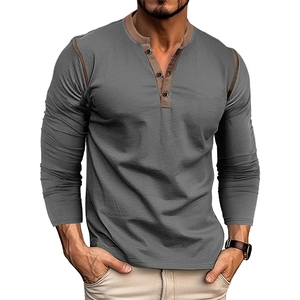 Detail of grey men's Henley shirt featuring a brown contrast collar and three-button placket