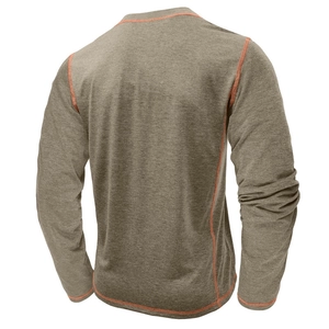 Close-up of olive green long sleeve shirt with orange flatlock seams and breathable texture