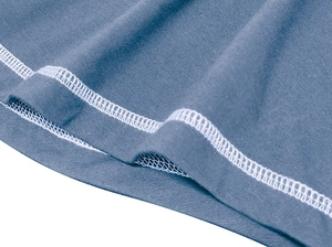 Detail of blue Henley shirt hem featuring high-quality white double-needle stitching