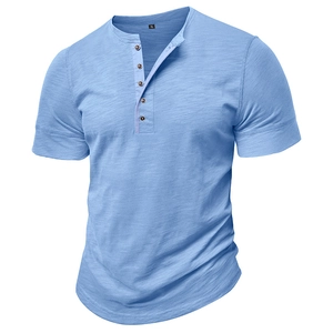 Detail of light blue Henley shirt with five buttons and textured slub cotton fabric