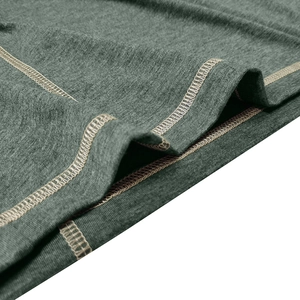 Macro view of dark marl green knit fabric with precise flatlock stitching for durability