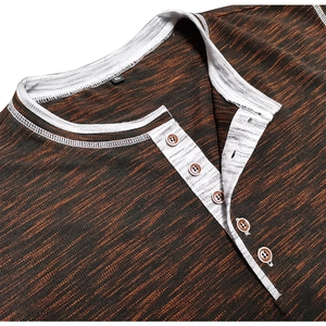 Close-up of Henley shirt collar with wood-style buttons and orange knit texture